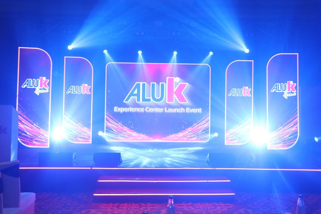 AluK Experience Center Launch Event with dramatic blue LED stage and custom light beams
